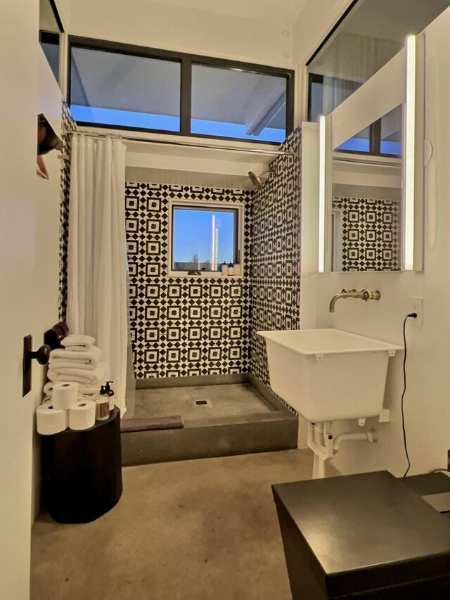 bathroom with sink and a shower with curtain