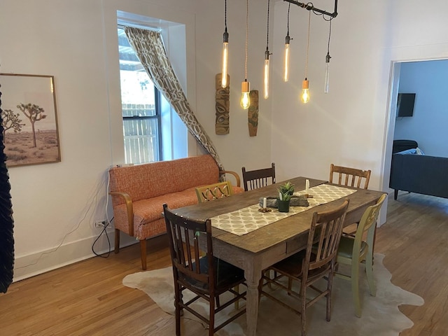 dining area with wood-type flooring