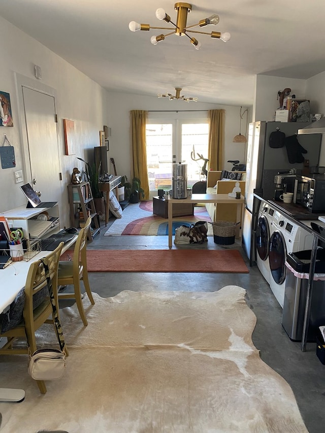 interior space with washer and clothes dryer, french doors, and an inviting chandelier