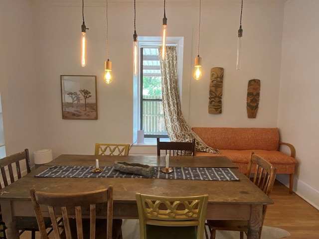 dining area with hardwood / wood-style flooring