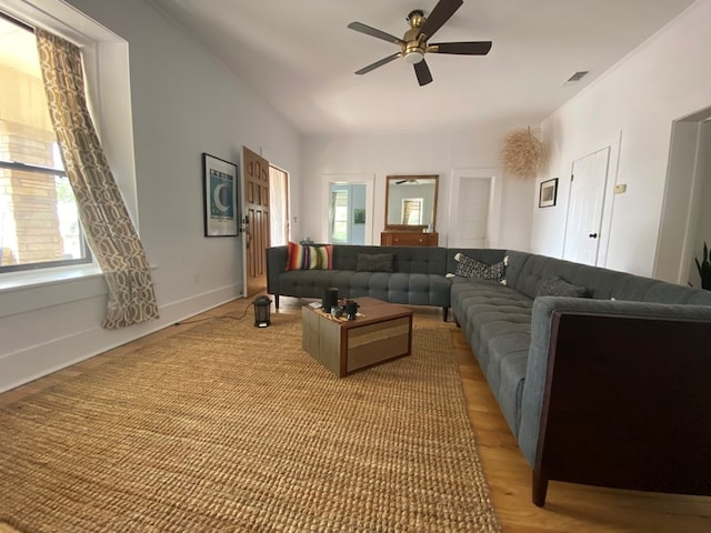 living room with hardwood / wood-style floors and ceiling fan