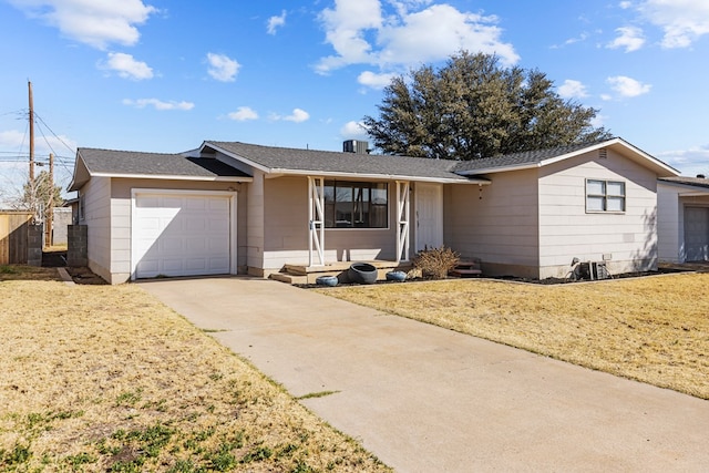 ranch-style home with a garage and a front lawn