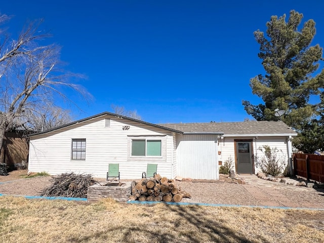 view of front of house featuring fence