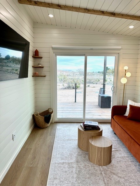 interior space with recessed lighting, wooden walls, and wood finished floors