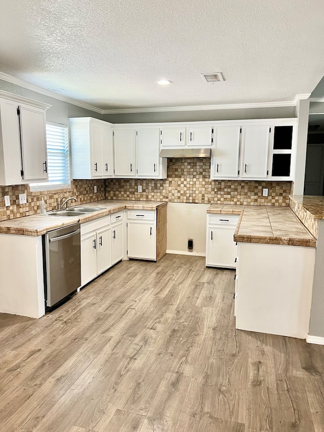 kitchen with stainless steel dishwasher, white cabinetry, and light hardwood / wood-style flooring