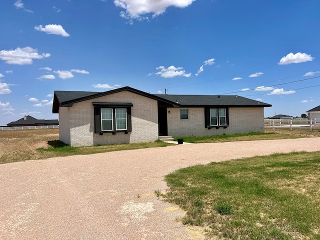 ranch-style house with a front yard