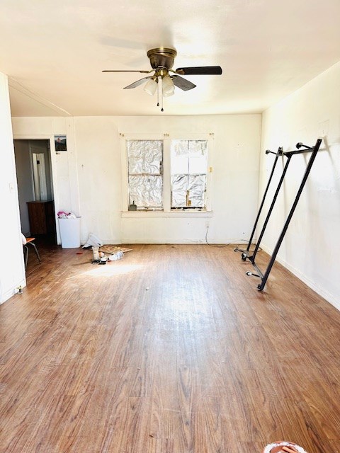 empty room featuring ceiling fan and hardwood / wood-style flooring