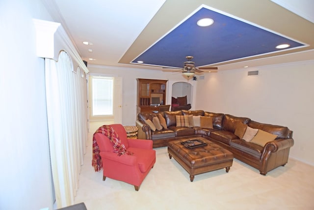 living room featuring ceiling fan and ornamental molding