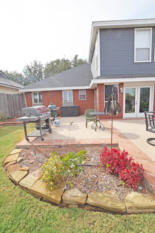 back of house with a patio and french doors