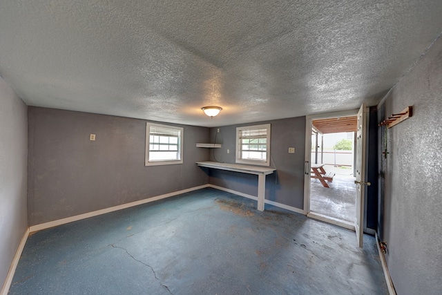 basement featuring a textured ceiling