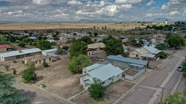 birds eye view of property with a mountain view