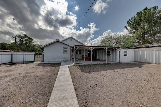 back of property featuring a patio