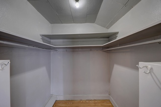 spacious closet featuring light hardwood / wood-style floors