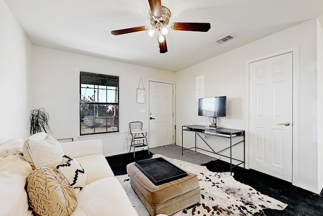 living room with carpet and ceiling fan