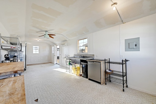 interior space featuring a wall unit AC, electric panel, a wealth of natural light, and ceiling fan