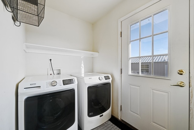 washroom with washing machine and clothes dryer