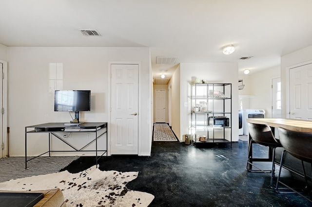 living room featuring washer and clothes dryer