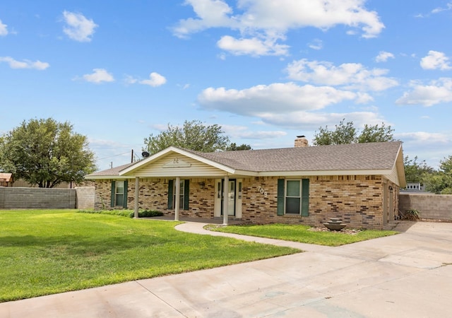 single story home featuring a front yard