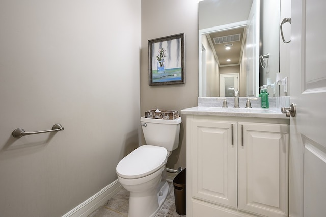 bathroom featuring tile patterned flooring, vanity, and toilet