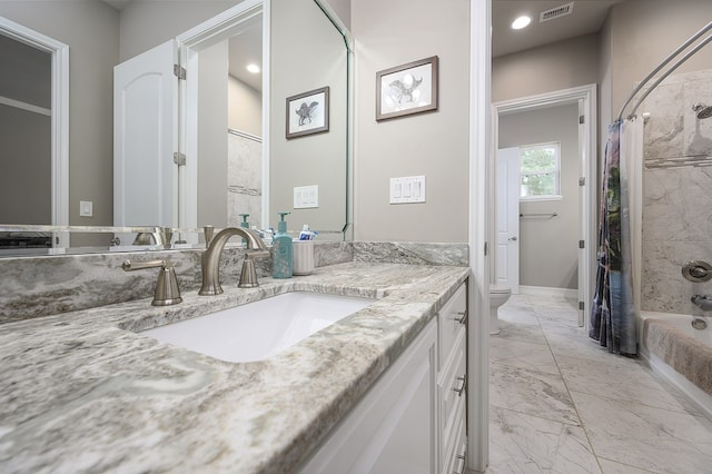 full bathroom featuring toilet, vanity, and shower / tub combo with curtain