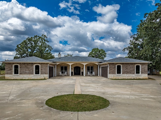 ranch-style house featuring a garage