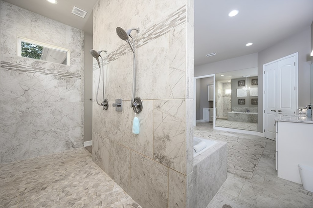 bathroom featuring plus walk in shower and vanity