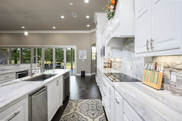 kitchen with custom exhaust hood, light stone counters, white cabinetry, and dark wood-type flooring