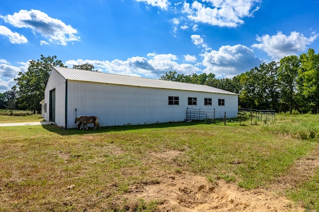 exterior space with a lawn and an outdoor structure