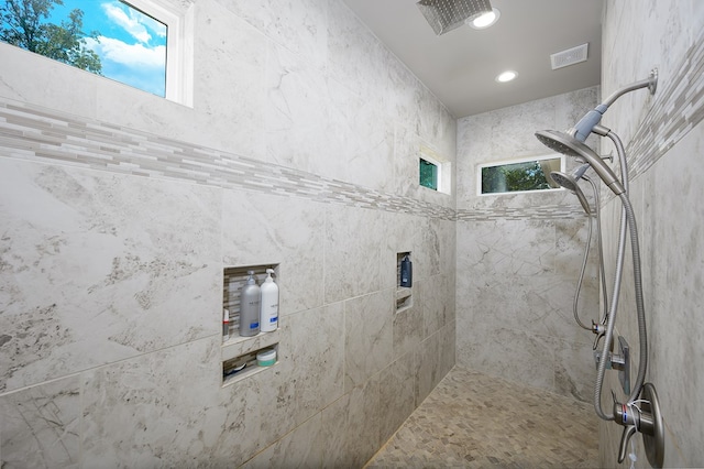 bathroom featuring tiled shower