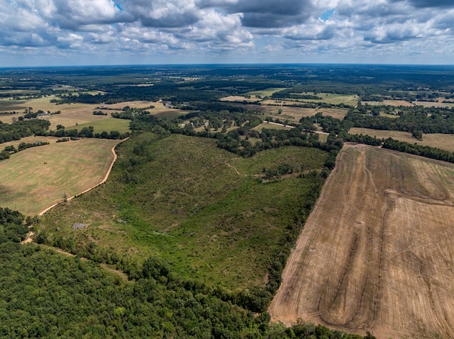 birds eye view of property featuring a rural view