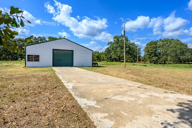 garage featuring a yard