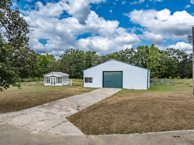 view of outbuilding featuring a yard and a garage