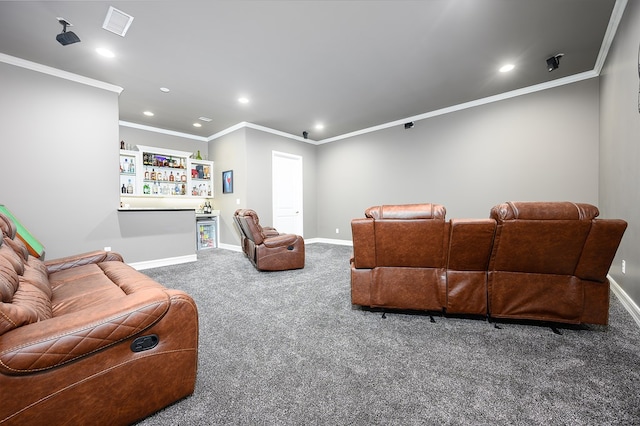 carpeted home theater featuring bar area and ornamental molding