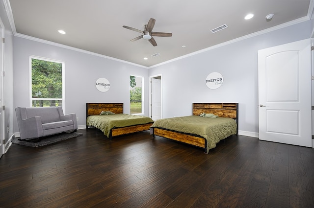 bedroom featuring ceiling fan, dark hardwood / wood-style flooring, and crown molding