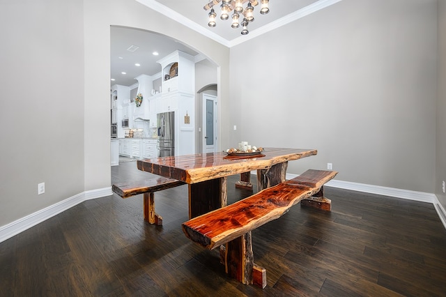 dining area with dark hardwood / wood-style floors and ornamental molding