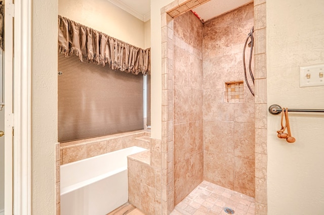 full bath featuring a garden tub, crown molding, and tiled shower