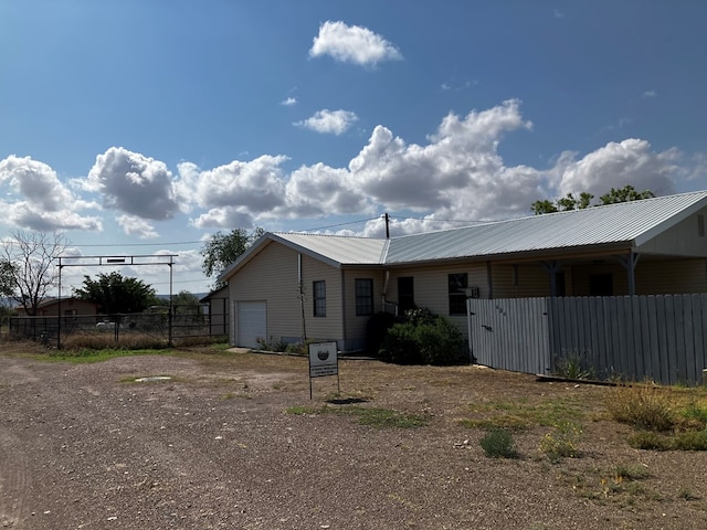 rear view of house with a garage