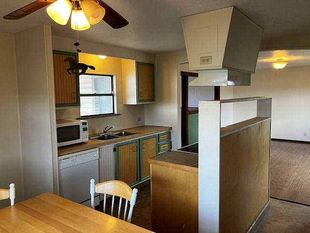 kitchen featuring white appliances, extractor fan, ceiling fan, sink, and dark hardwood / wood-style floors