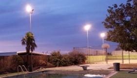 view of pool at dusk