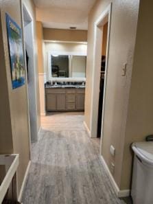 corridor featuring light hardwood / wood-style floors