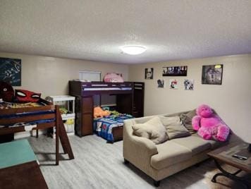 interior space featuring a textured ceiling and light hardwood / wood-style flooring