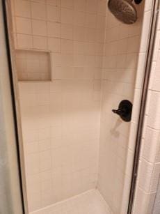 bathroom with a tile shower