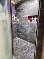 bathroom featuring walk in shower