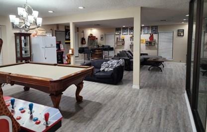 playroom featuring hardwood / wood-style flooring and pool table