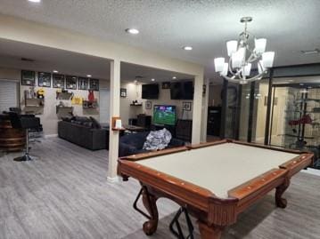 recreation room featuring hardwood / wood-style floors, a textured ceiling, and billiards