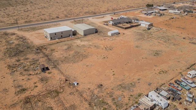 birds eye view of property with view of desert