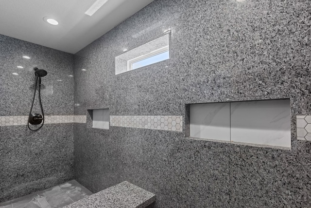 full bath featuring tiled shower