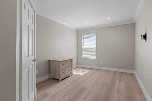 empty room with baseboards, recessed lighting, light wood-type flooring, and crown molding