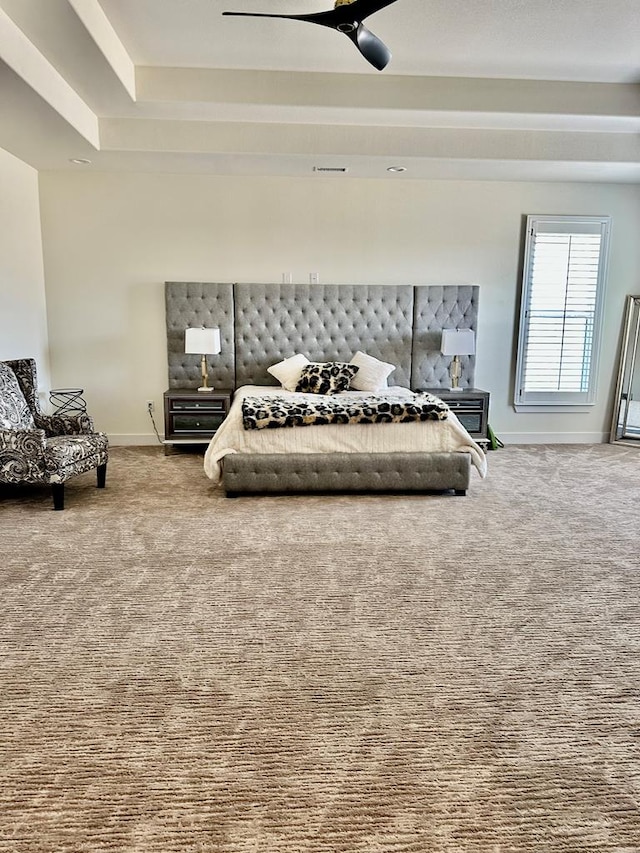 carpeted bedroom with baseboards and ceiling fan