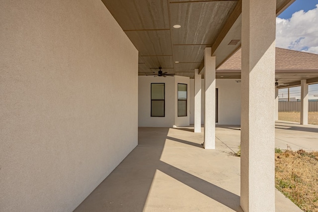 view of patio with a ceiling fan and fence